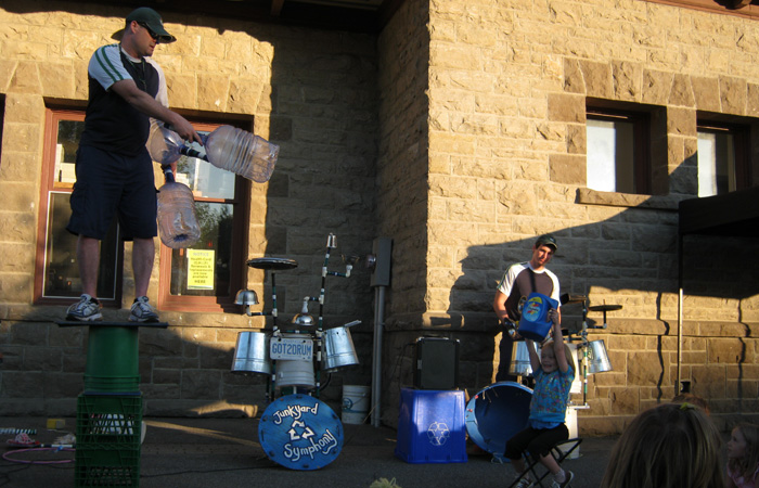 The cheerleader cues the crowd.