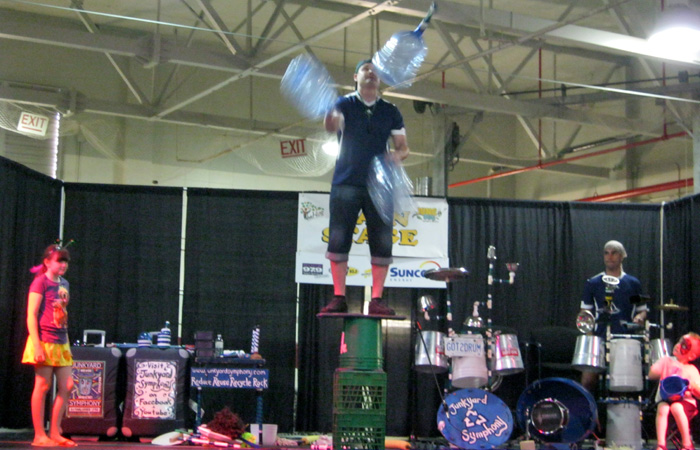 Junkyard Jonny juggles gigantic juggling jugs.