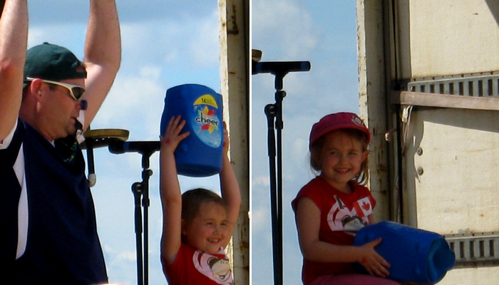Cheerleader holds up the Cheer Box.