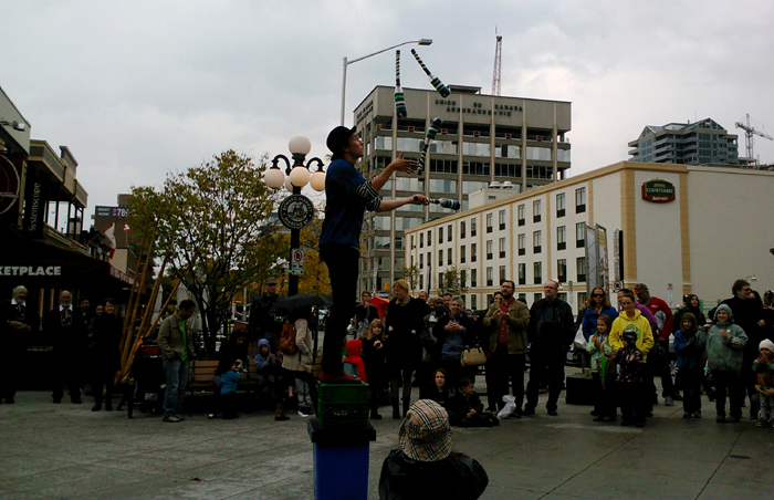 Juggling Joe juggles 4 bottle clubs.