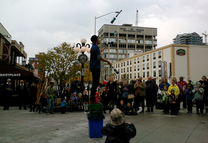 Juggling Joe juggles 4 bottle clubs.