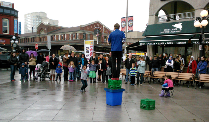 A volunteer throws a bottle club.