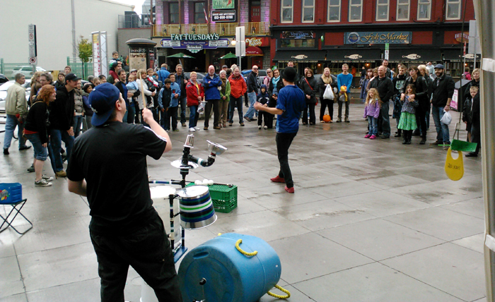 Juggling Joe catches his hat on his head.