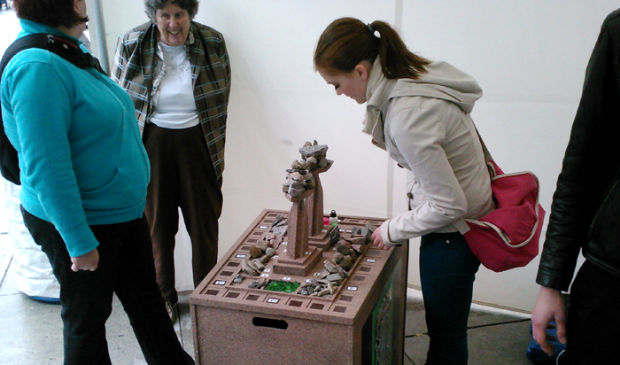 A young woman plays Rockt Towers.